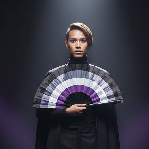Model in black clothing holding an open black, gray, white, and purple folding fan