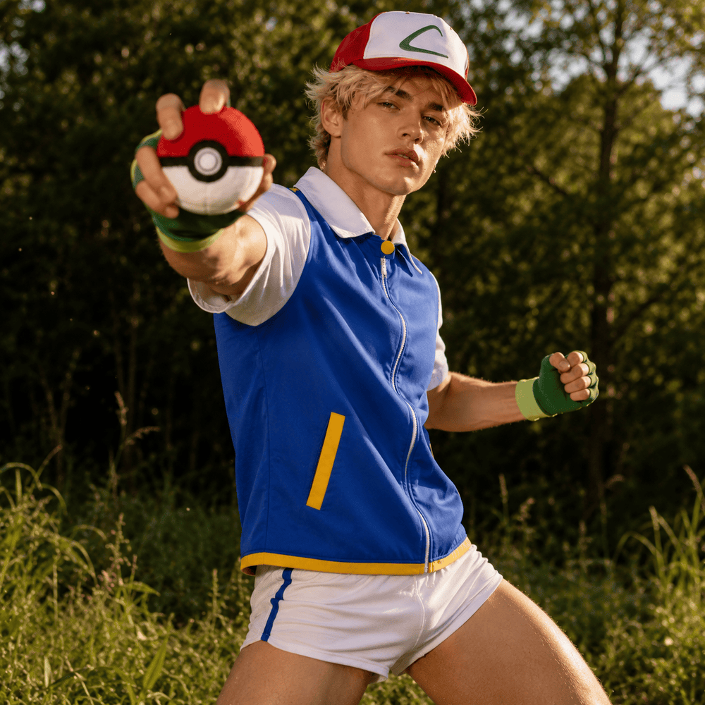 Model wearing a blue Ash Ketchum costume with red-and-white cap, gloves, and Poké Ball