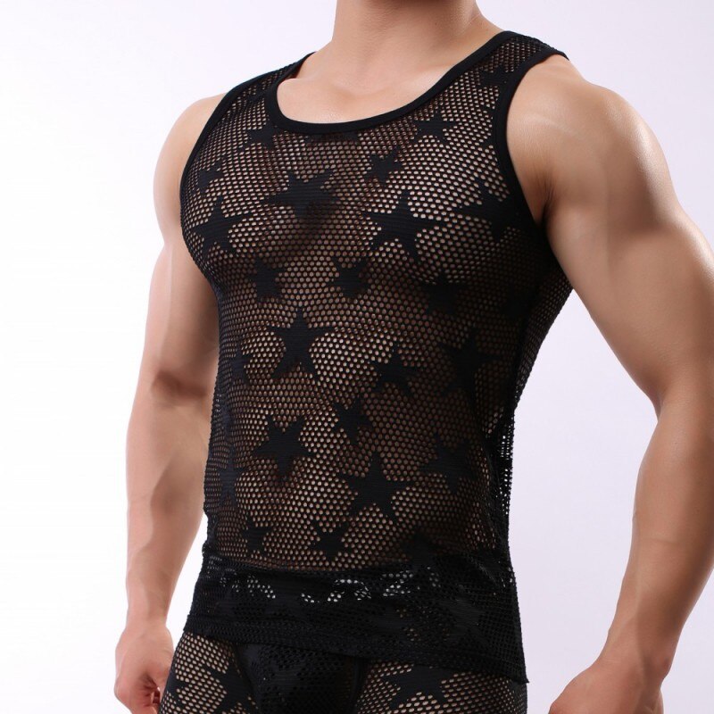 Cropped muscular model wearing a black sheer mesh tank with star-shaped patterns