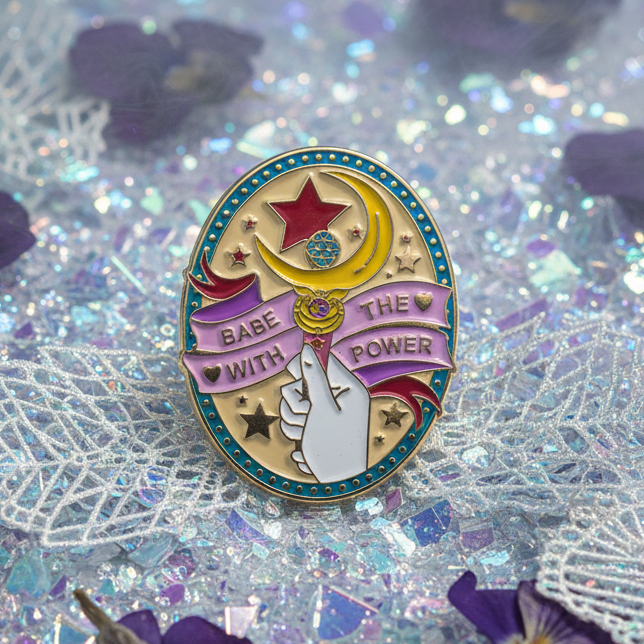 Enamel pin reading “Babe With the Power,” with a raised fist, star and crescent design