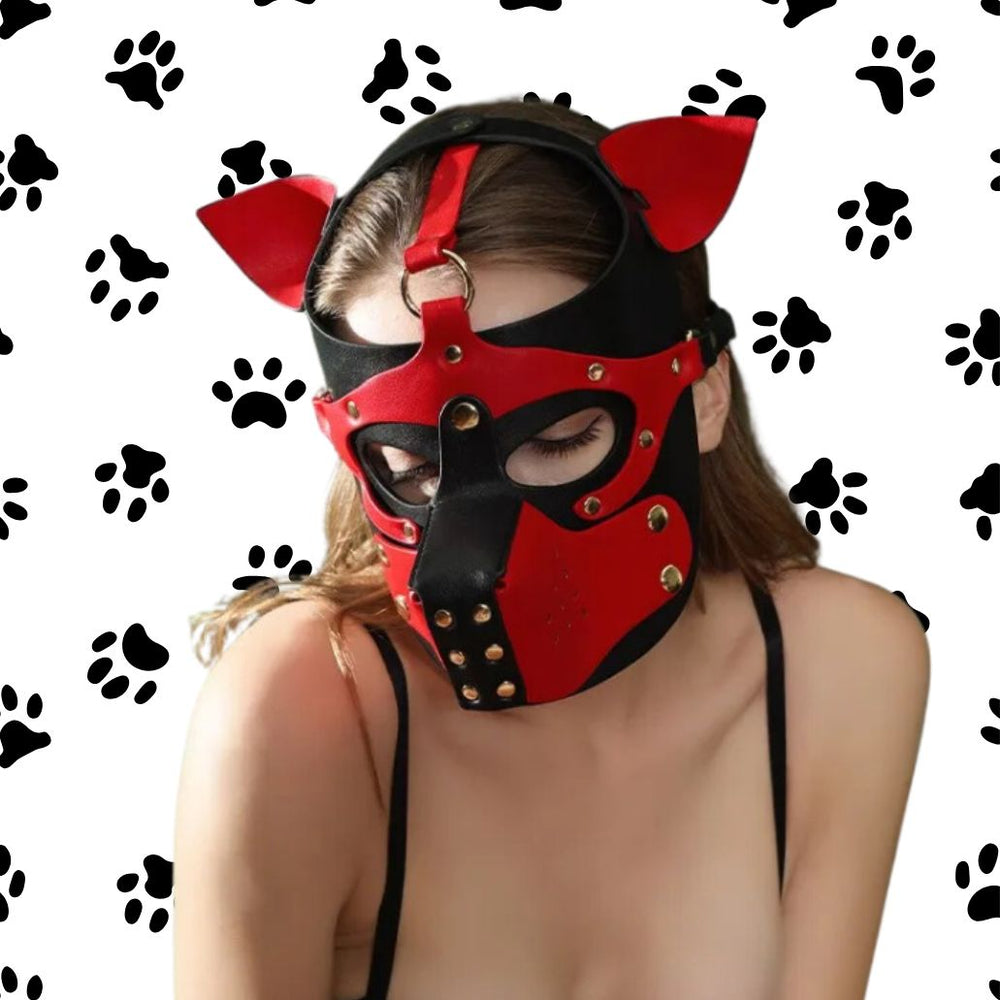 Model wearing a red-and-black leather puppy mask with pointed ears and rivets