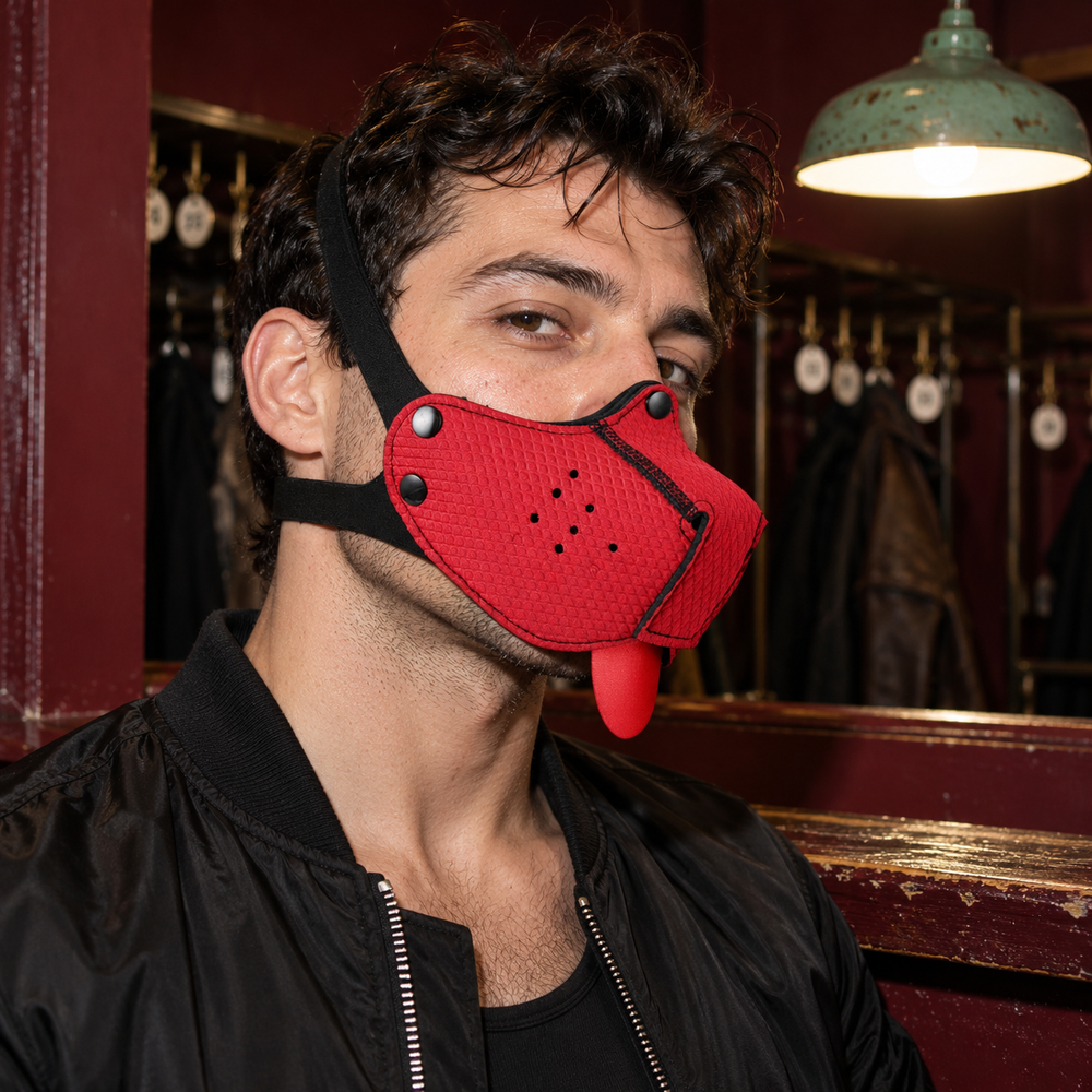 Adult model wearing a red pup mask with black straps in a coat-check setting.