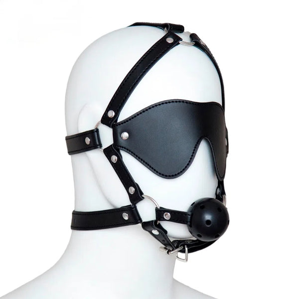 Black leather BDSM hood with eye covering, straps, metal rings, and a round ball gag on a mannequin