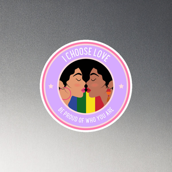 Round Pride magnet showing two women kissing, with “I CHOOSE LOVE” and “BE PROUD OF WHO YOU ARE”