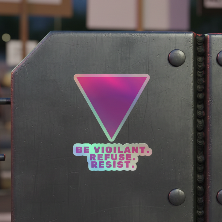 Holographic sticker on a metallic surface, with a downward-pointing triangle above BE VIGILANT. REFUSE