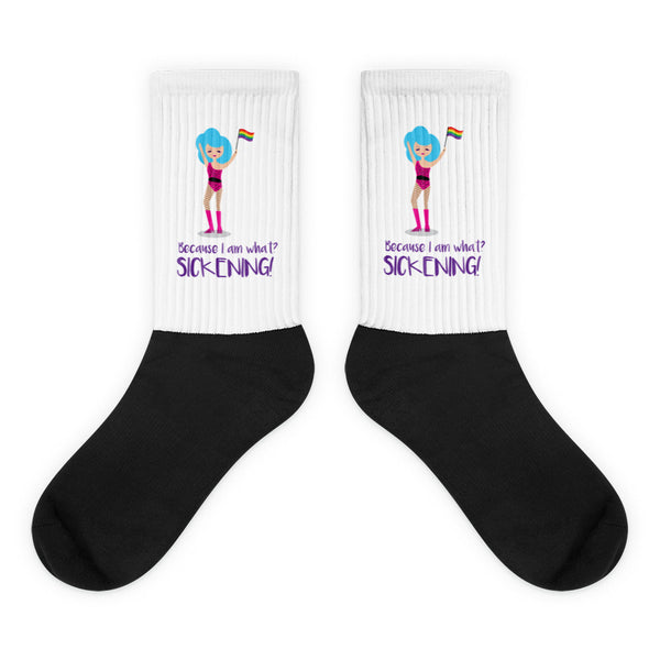 Pair of black-and-white crew socks with a cartoon figure and Pride flags, reading “Because I am what? SICKENING!”