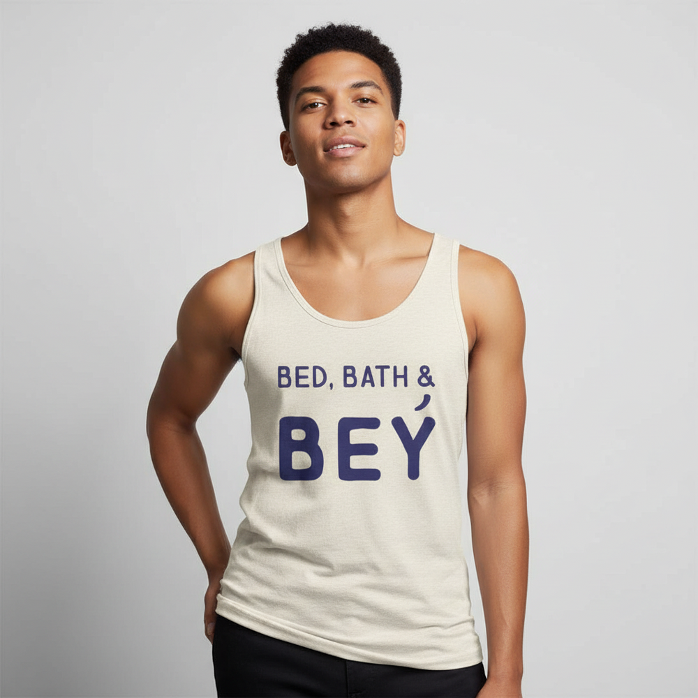 Unisex cream tank top with bold blue "BED, BATH & BEY" lettering, worn by a young man with curly hair against light gray.