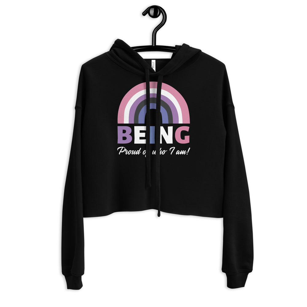 Genderfluid crop hoodie in black with a pastel rainbow, bold “BEING” text, and “Proud of who I am!” slogan—pride fashion.