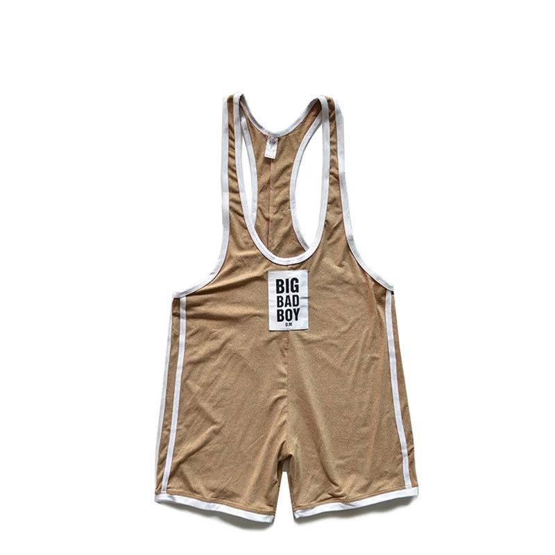 Front view of a tan wrestling singlet with white trim and a BIG BAD BOY chest patch