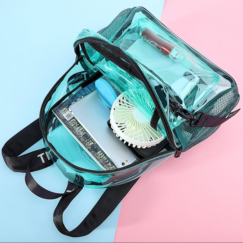 Open transparent turquoise backpack filled with a fan, phone, cosmetics, and other festival items