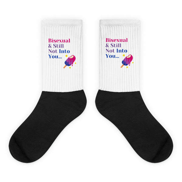 Pair of black-and-white crew socks reading “Bisexual & Still Not Into You…”