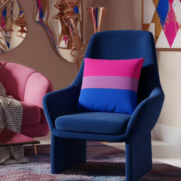 Modern living room with dark blue armchair, Bisexual Premium Pillow in pink, purple, and blue stripes, pink sofa