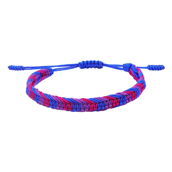Close-up of a braided blue, pink, and purple adjustable bracelet on white