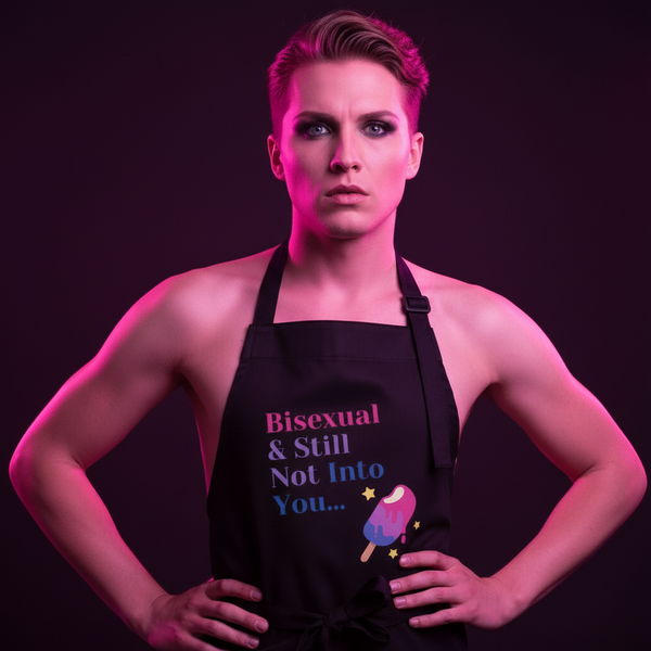 Front-facing model wearing a black apron reading “Bisexual & Still Not Into You…” with a popsicle graphic