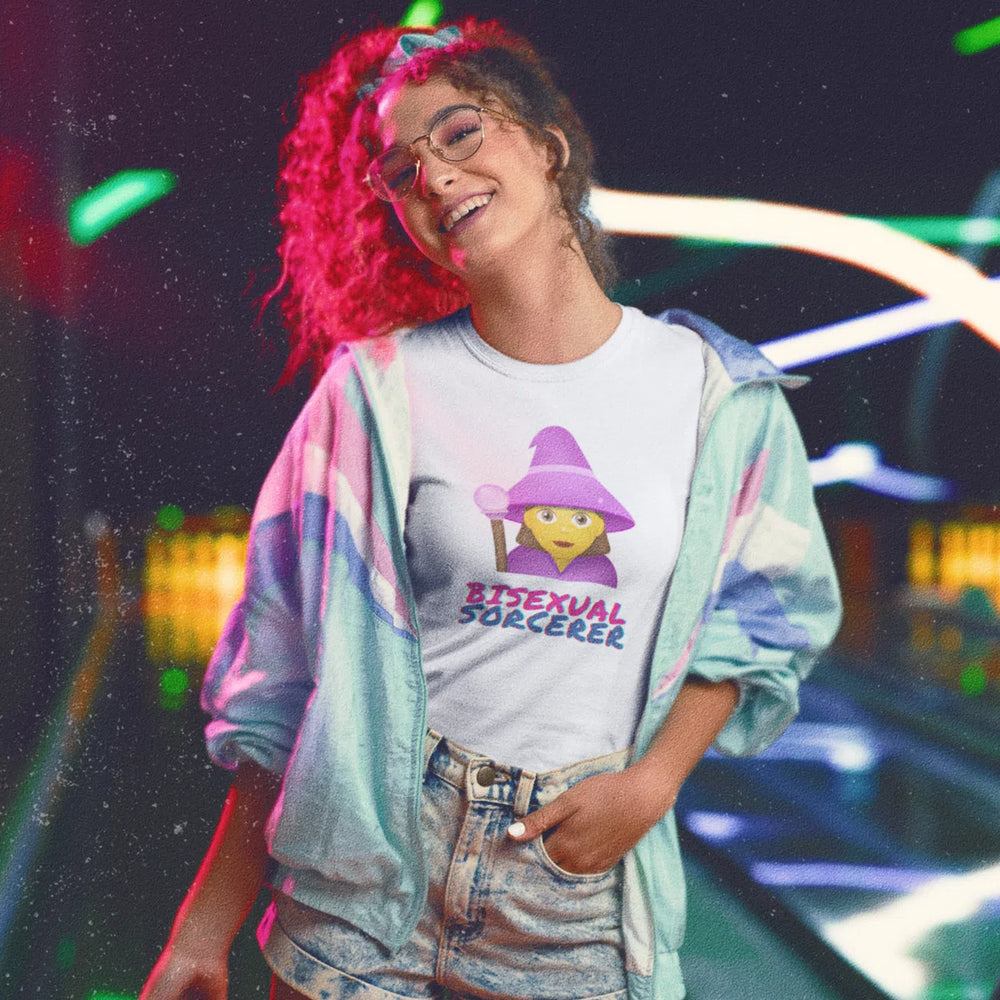 Model wearing a white bisexual sorcerer T-shirt with a cartoon wizard graphic and text
