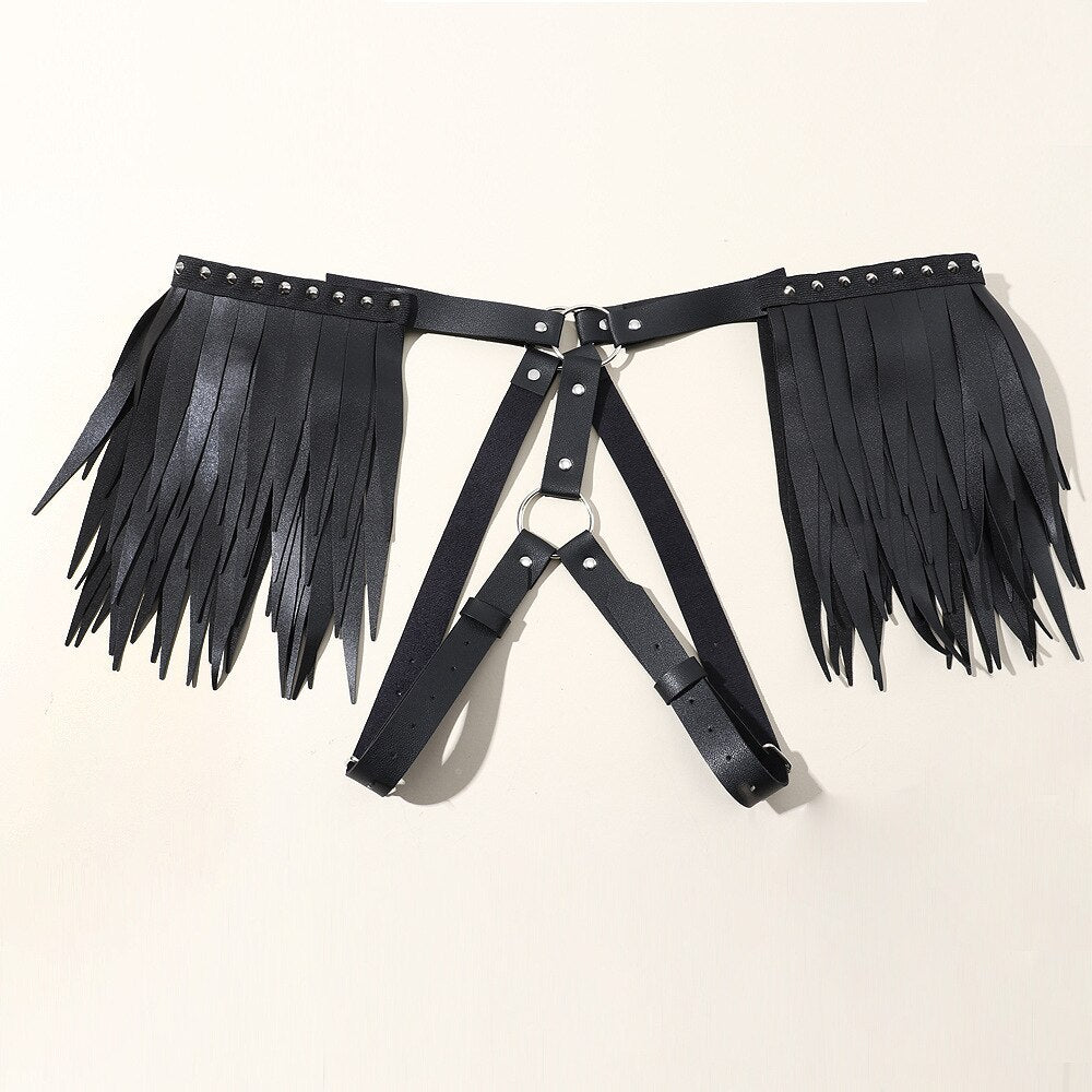 Black leather-style angel wing harness laid flat, with studded straps and leg loops
