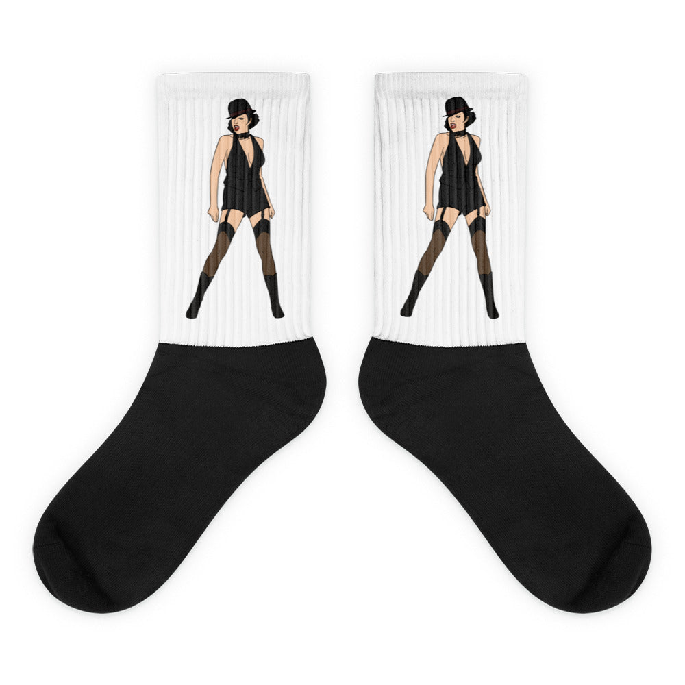 Pair of black-and-white socks with a dancer in a black cabaret outfit on each cuff