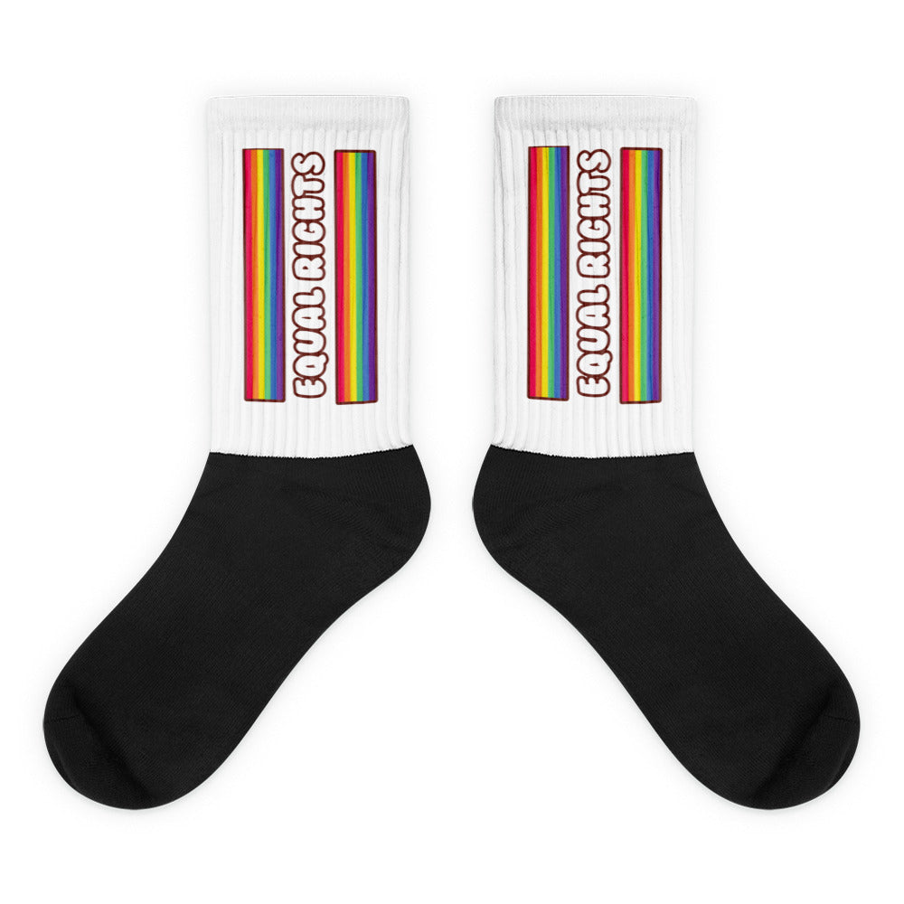 Pair of black-and-white socks with rainbow stripes and “Equal Rights” text on the cuffs