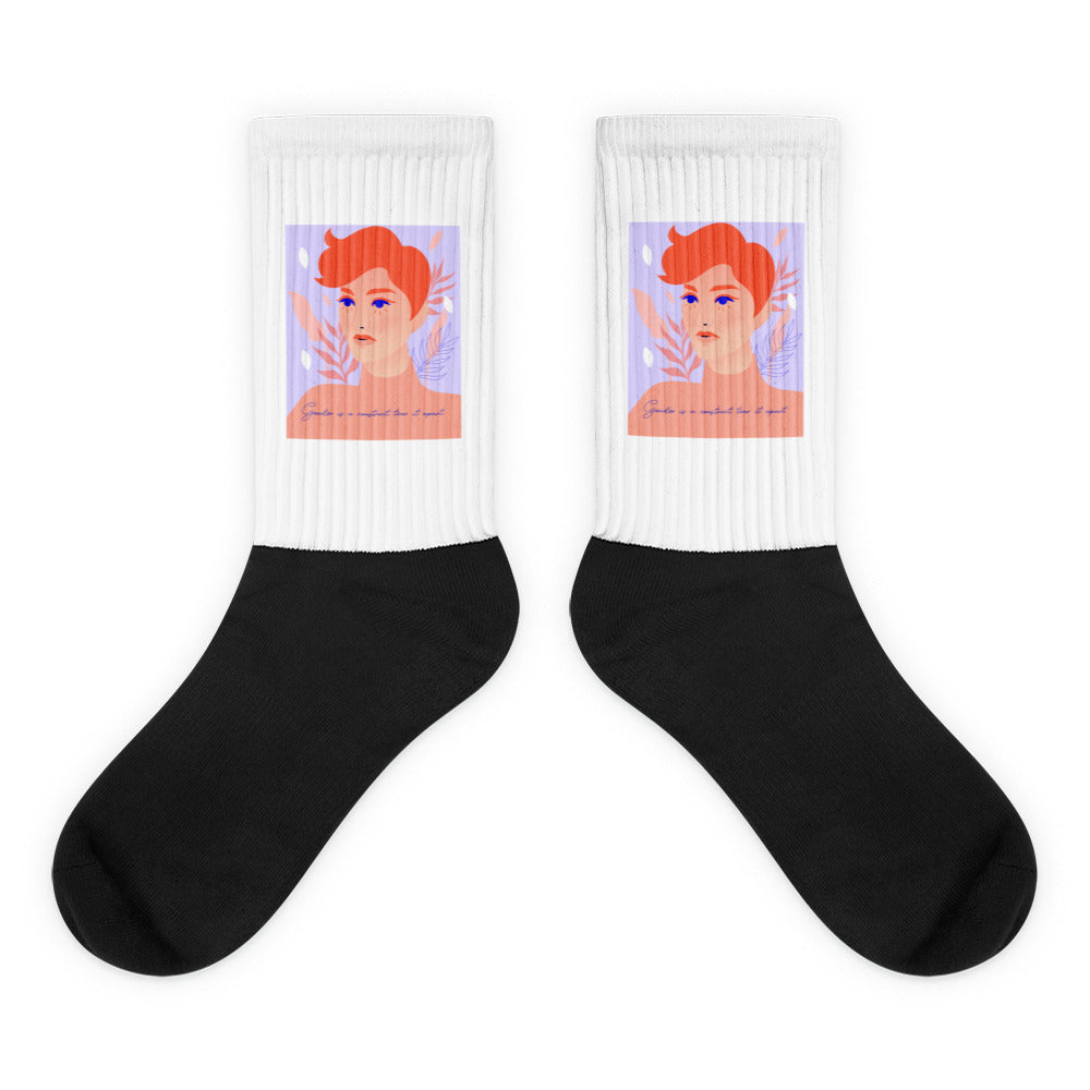 Pair of crew socks with white ribbed cuffs, black feet, and illustrated red-haired faces