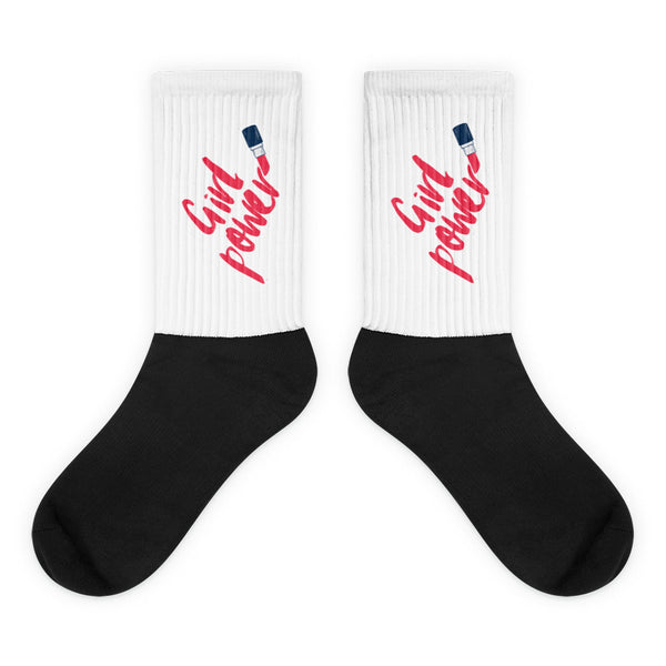 Pair of white and black socks with red “Girl Power” lettering and lipstick graphics