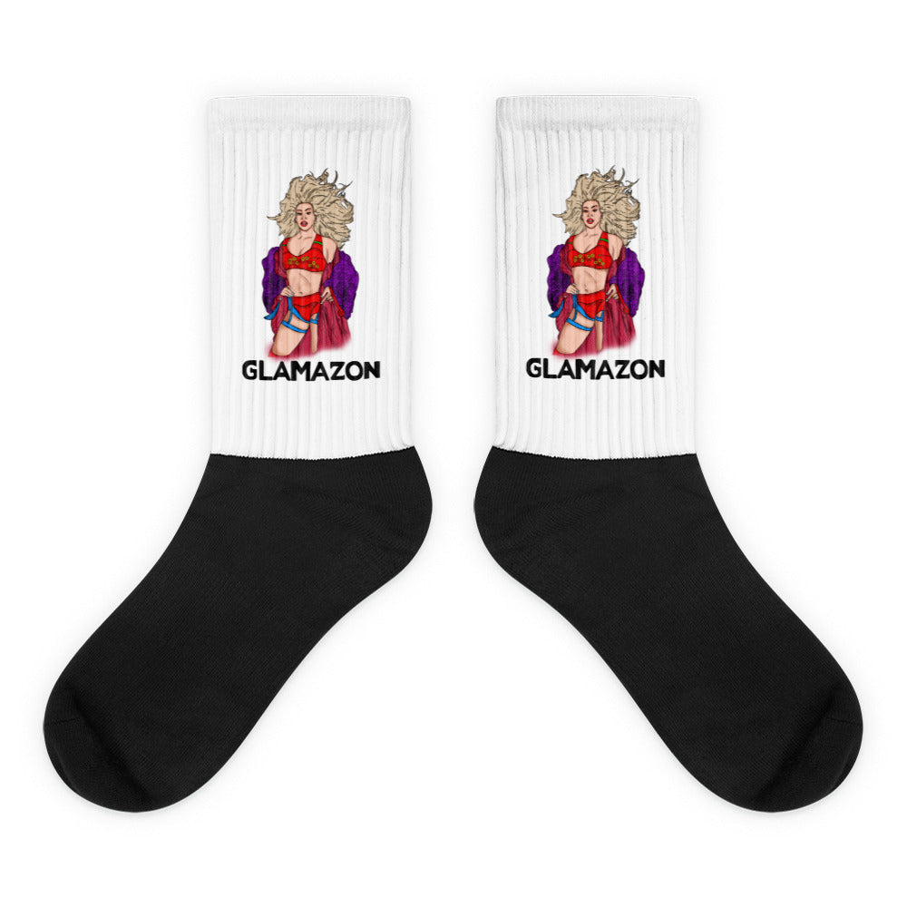 Pair of black-and-white socks with a glamorous pin-up illustration and “GLAMAZON” text