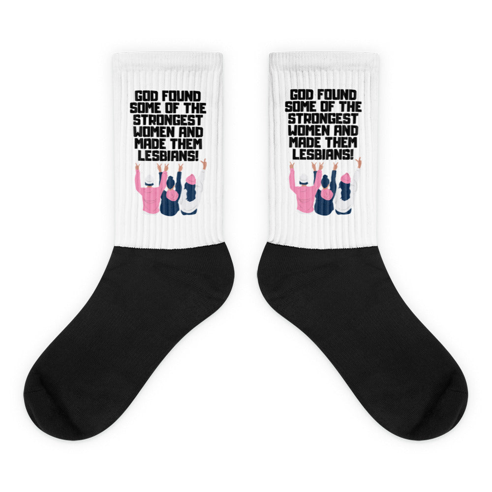 Pair of black-and-white socks reading “God found some of the strongest women and made them lesbians!”