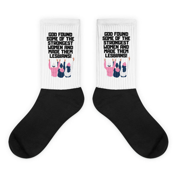 Pair of black-and-white socks reading “God found some of the strongest women and made them lesbians!”