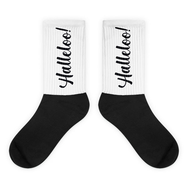 Halleloo! Socks showcase a bold black sole and white cuff-to-ankle area featuring “Halleloo!” in script, embodying vibrant queer energy and self-expression with luxurious comfort.