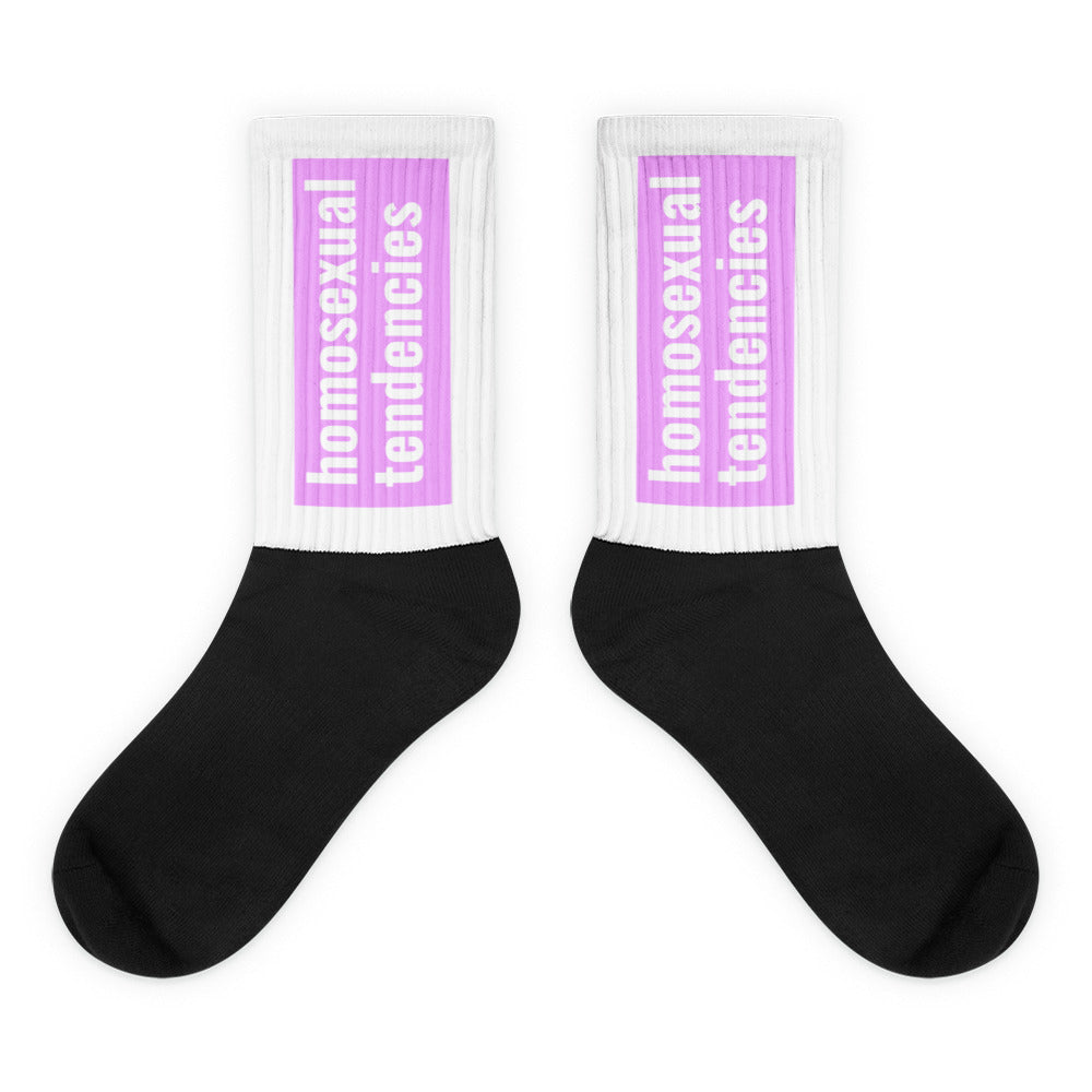 Pair of black crew socks with white cuffs and purple “homosexual tendencies” panels