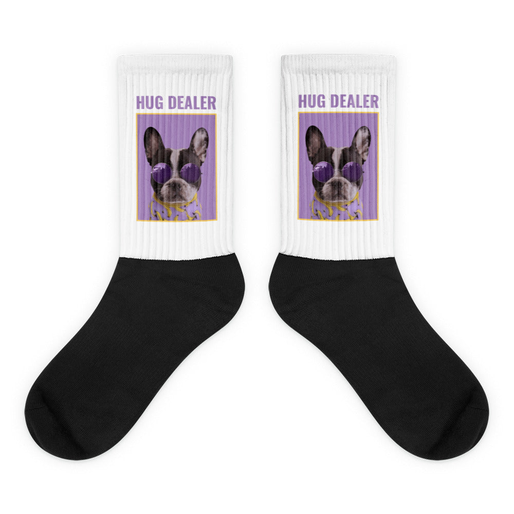Pair of black-and-white crew socks with French bulldog graphics and “HUG DEALER” text