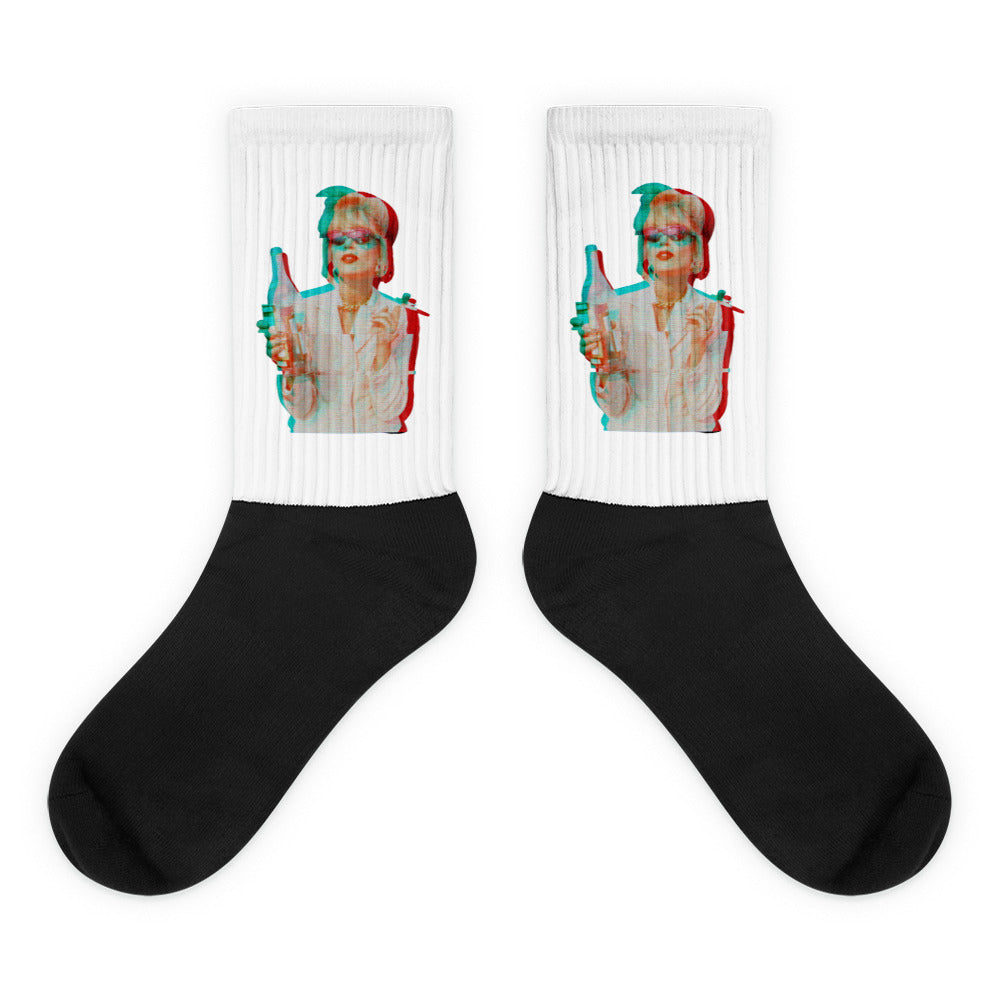 Pair of black-and-white socks with a retro woman holding a bottle on each cuff