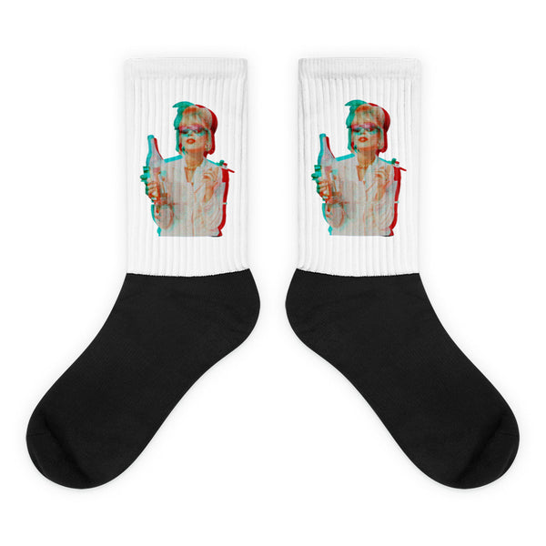 Pair of black-and-white socks with a retro woman holding a bottle on each cuff