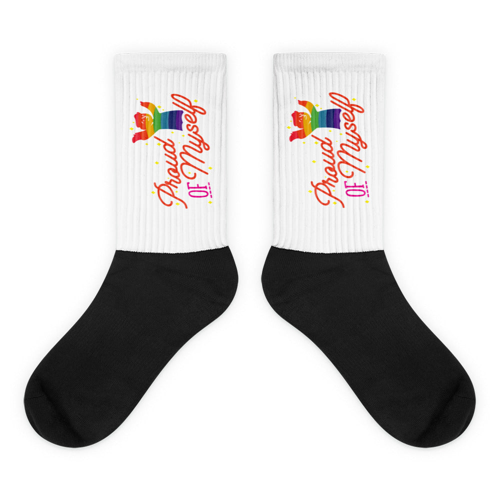 Pair of black-and-white crew socks with rainbow cat graphics and “Proud Of Myself” text