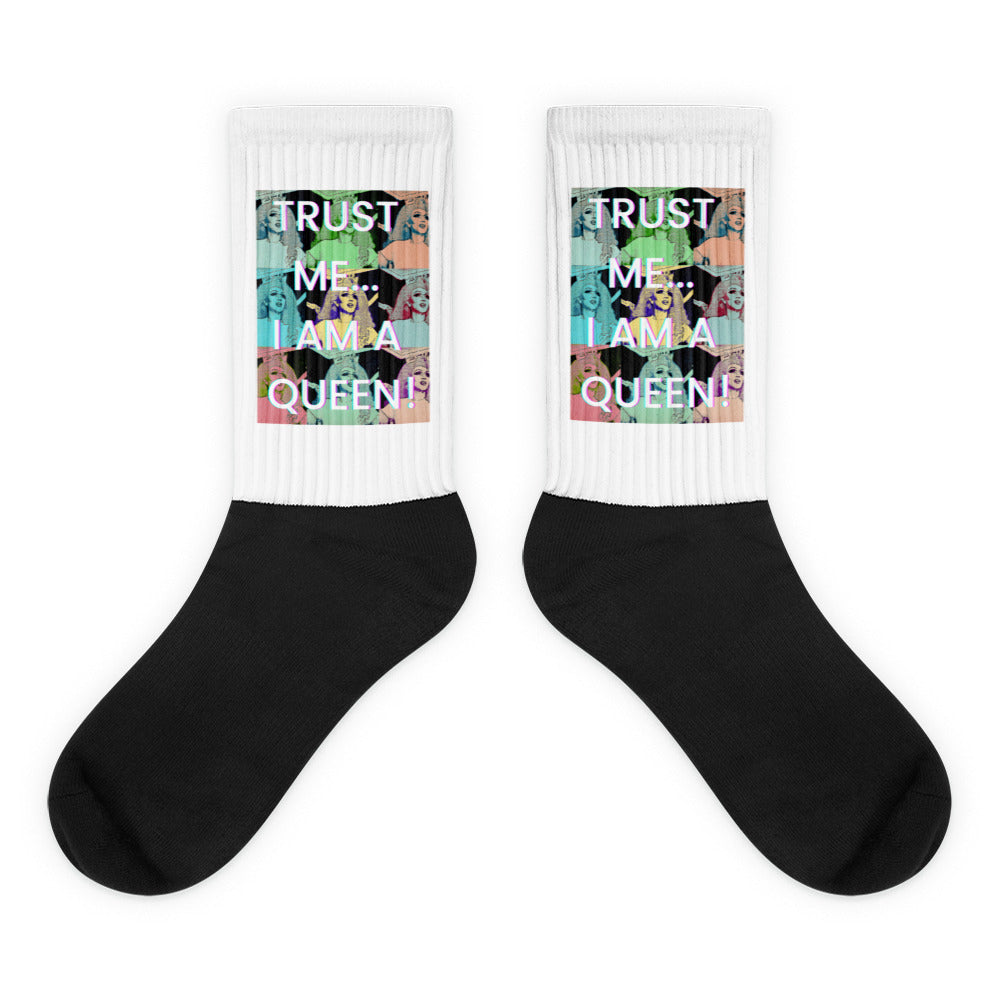 Pair of black-and-white socks reading “TRUST ME... I AM A QUEEN!”