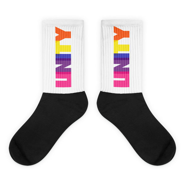 Unity Socks: Crew-length socks featuring a bold black foot and a white ribbed leg with UNITY in a vibrant rainbow gradient. Crafted for comfort and self-expression, embodying pride and empowerment.
