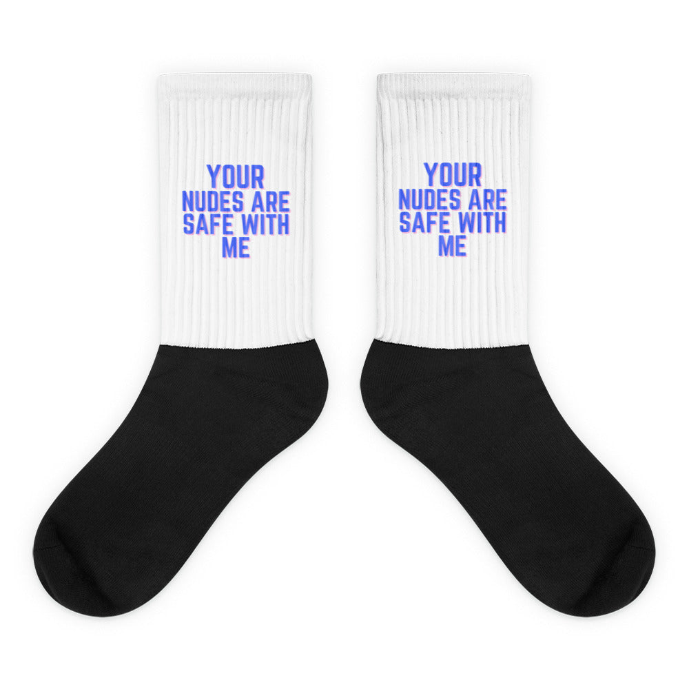Pair of black-and-white crew socks reading “YOUR NUDES ARE SAFE WITH ME”