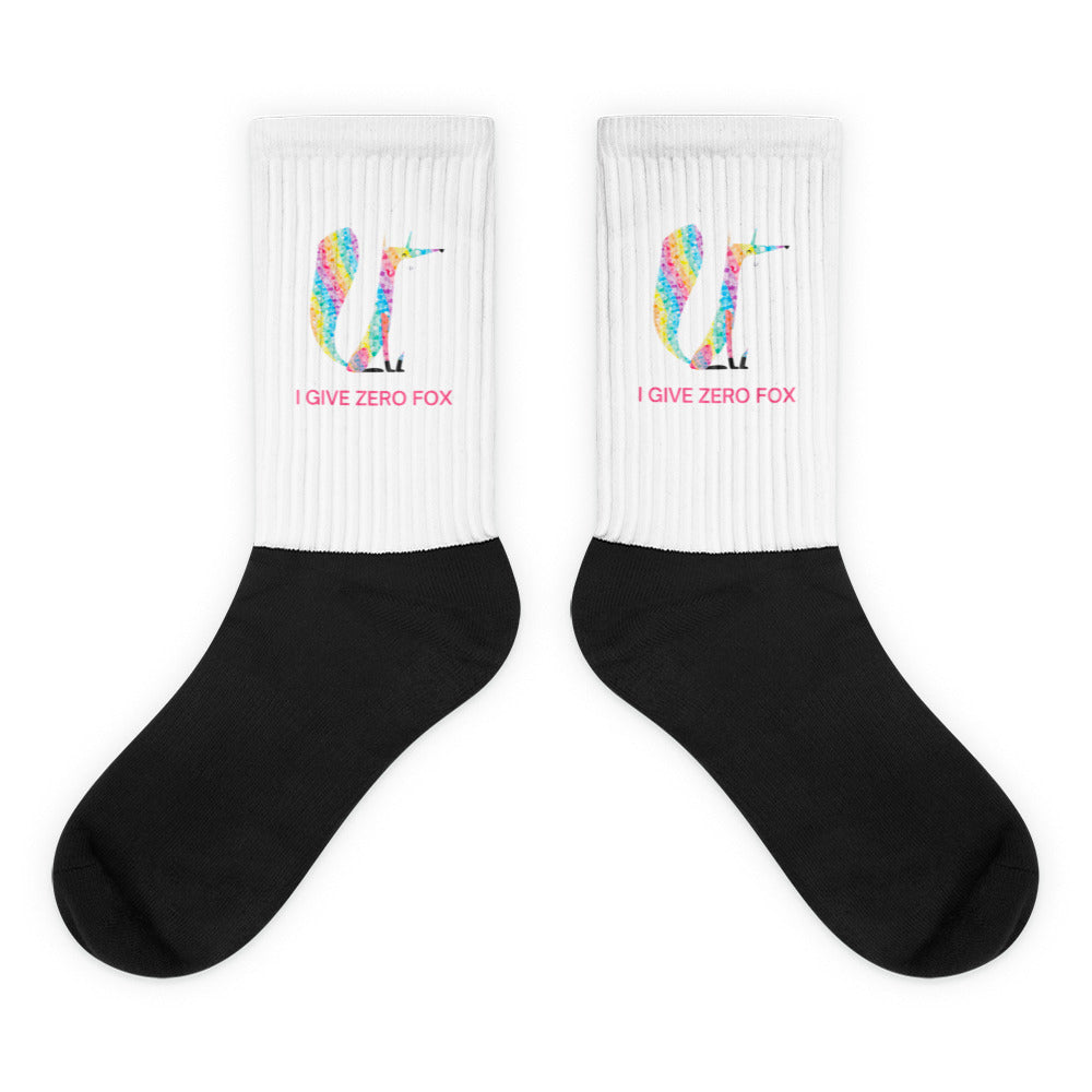 Pair of black-and-white ribbed socks with colorful fox graphics and “I GIVE ZERO FOX” text