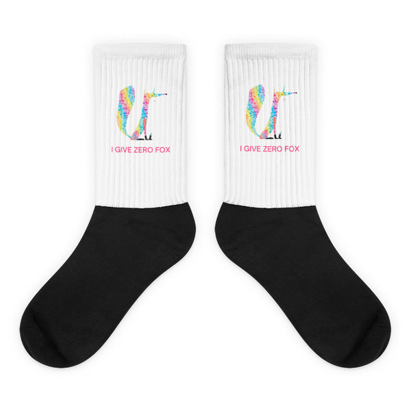 Pair of black-and-white ribbed socks with colorful fox graphics and “I GIVE ZERO FOX” text