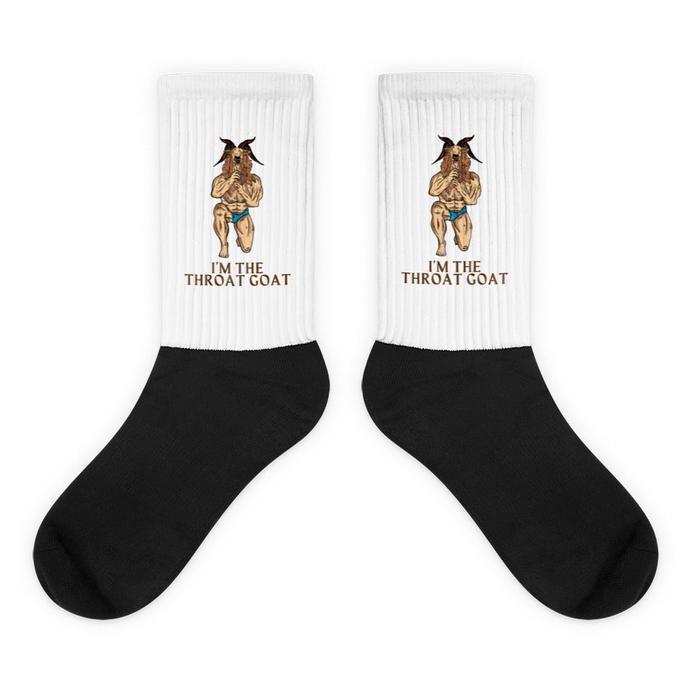 Pair of black-and-white crew socks with muscular goat illustrations and “I’M THE THROAT GOAT” text