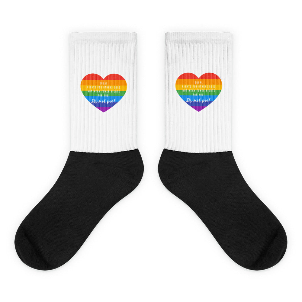 Pair of black-and-white crew socks; socks with “It's Not Pie” design