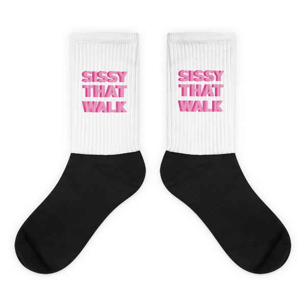 Sissy That Walk Socks: Bold, crew-length socks with a ribbed white leg featuring “SISSY THAT WALK” in pink, complemented by a black foot. A vibrant statement of pride and self-expression.