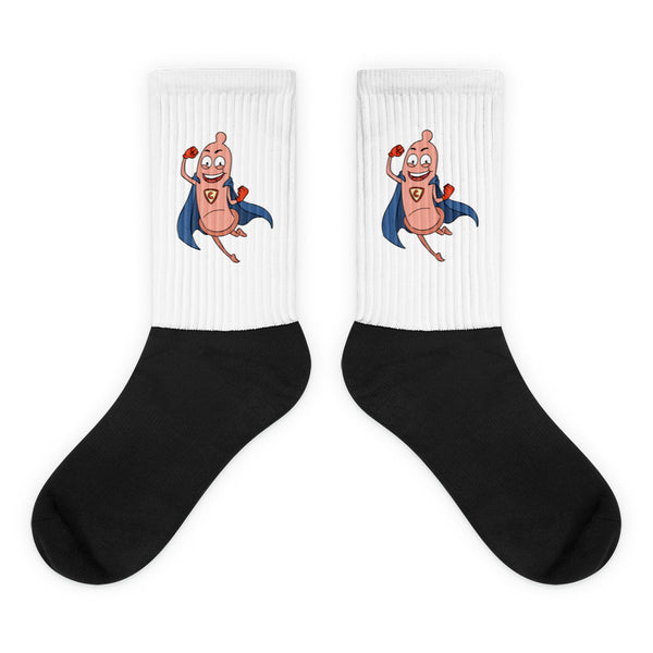 Pair of black-and-white crew socks with a smiling superhero condom character