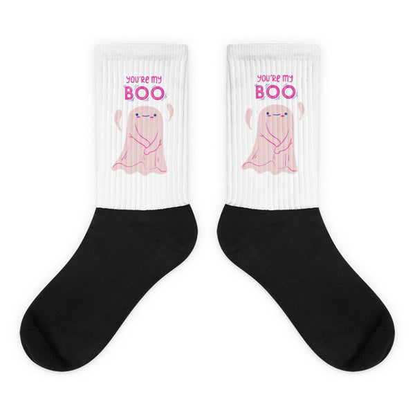 Pair of white-and-black socks with pink ghosts and “YOU’RE MY BOO” text
