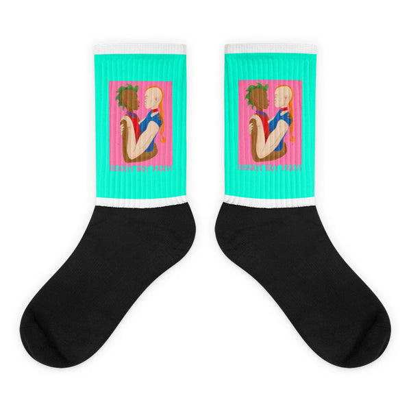Hearts Not Parts Socks feature a black foot and turquoise upper, adorned with art of diverse figures embracing, celebrating LGBTQIA+ pride and self-expression. Crafted in nylon blend, they promise comfort and vibrant visibility.