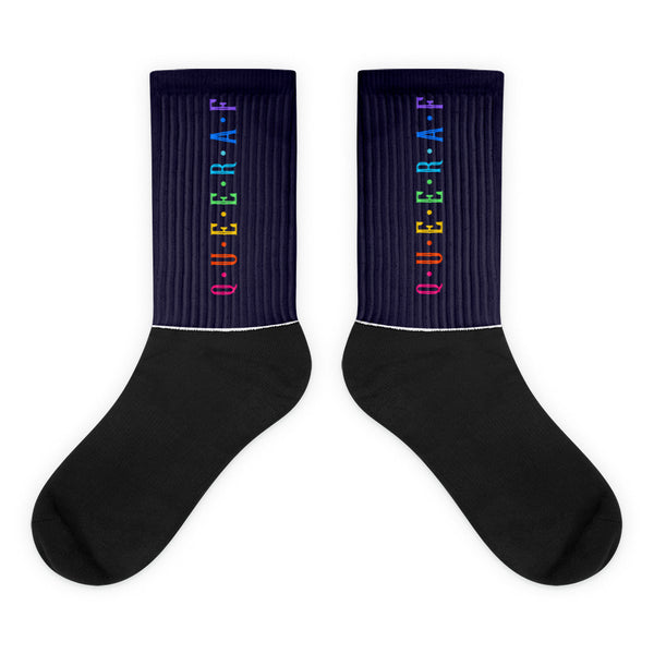 Queer AF Socks featuring rainbow-colored QUEER AF text on ribbed navy cuffs, black foot, showcasing pride and self-expression. Crafted from a nylon-cotton-spandex blend for comfort and style.