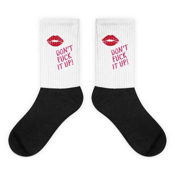 Don't Fuck It Up! Socks: Crew-length socks with a white ribbed upper, featuring a red lipstick-kiss and DON’T FUCK IT UP! text, contrasting a solid black foot, embodying vibrant, unapologetic queer pride.