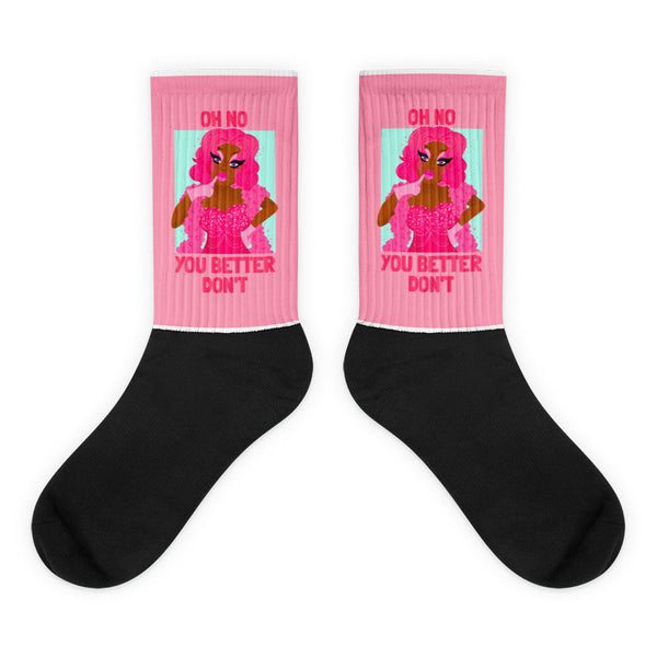 Oh No You Better Don't Socks feature a sassy pink-haired figure in a sparkling corset on pink crew socks, blending bold queer style with comfort and empowerment.
