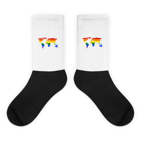Queer Map Socks feature a striking black foot and white leg, adorned with rainbow-striped world-map graphics. Crafted from a nylon-cotton-spandex blend, they offer comfort and prideful self-expression.