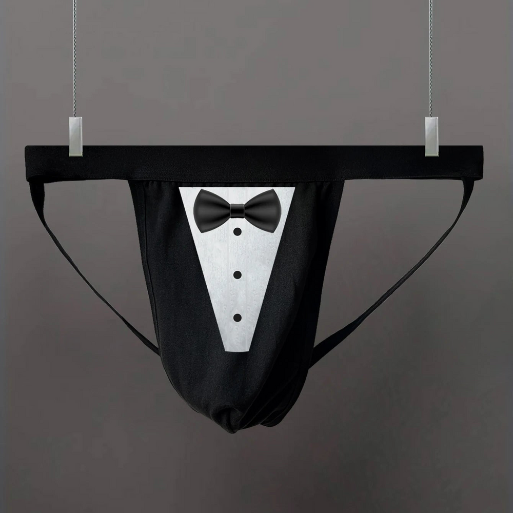Black thong hanging flat, with a white tuxedo bib, black bow tie, and three buttons