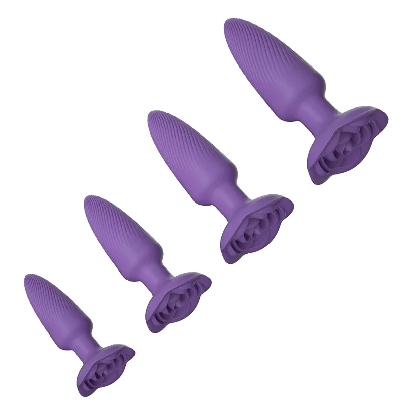 Four purple silicone anal plugs arranged diagonally, showing textured shafts and flared bases